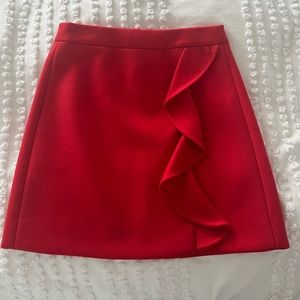 J Crew, vibrant red mini skirt. 100% wool.